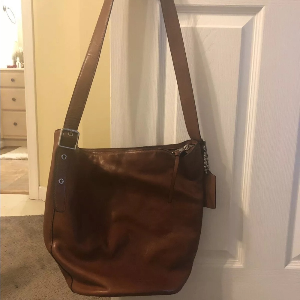 Brown leather Coach hobo bag.